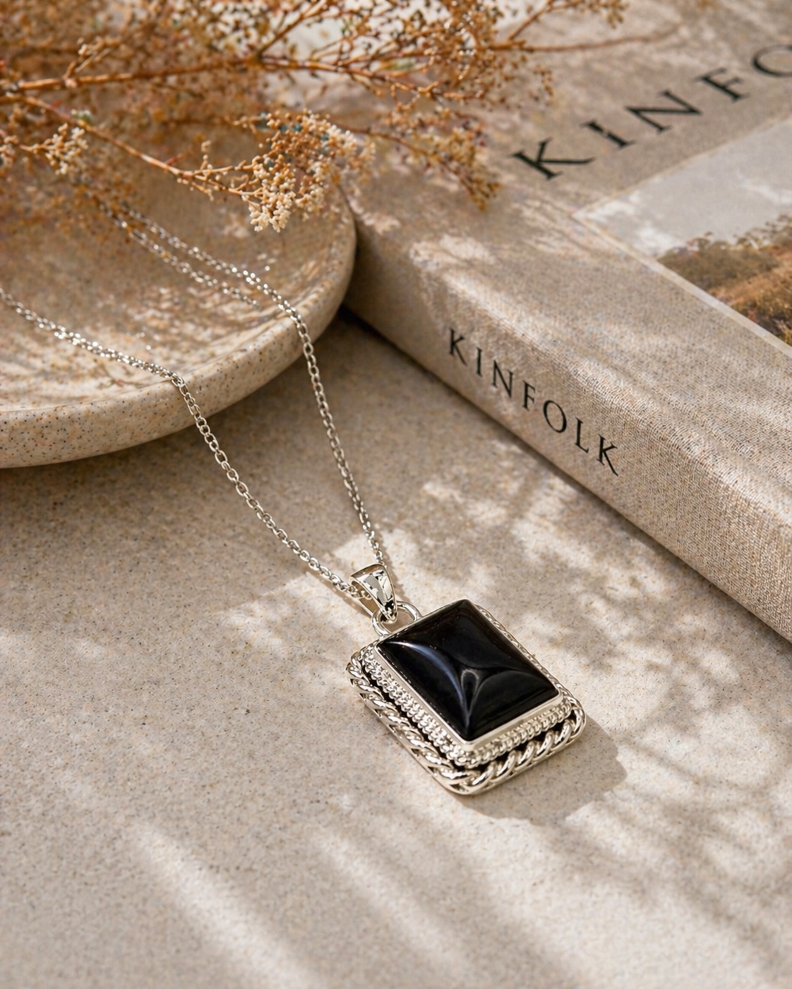 Black Onyx Pendant • Rectangle Braided Border — Hero photograph